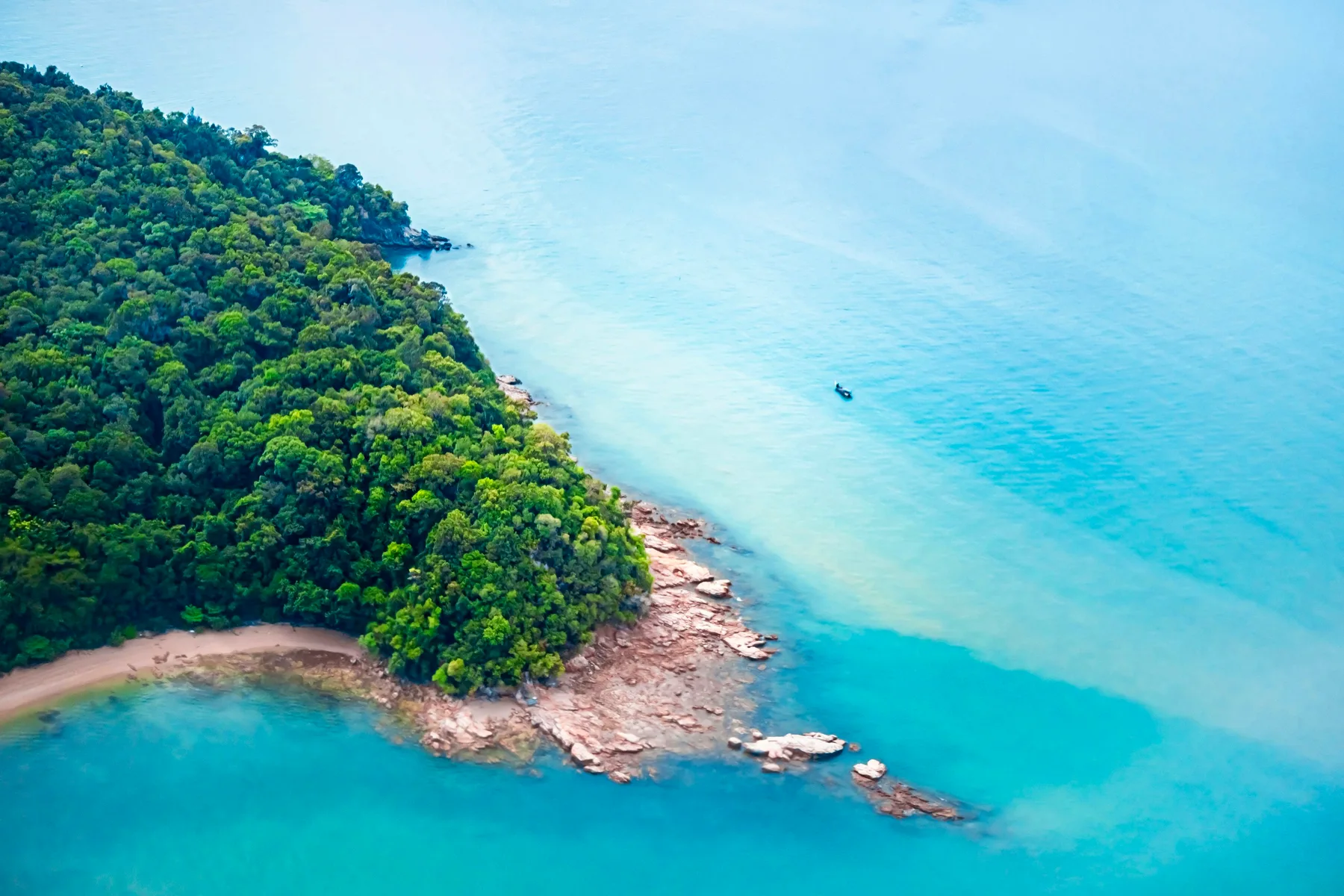Aerial view of a small green island in Langkawi, Malaysia; illustrative scenery, not a confirmed tour stop.